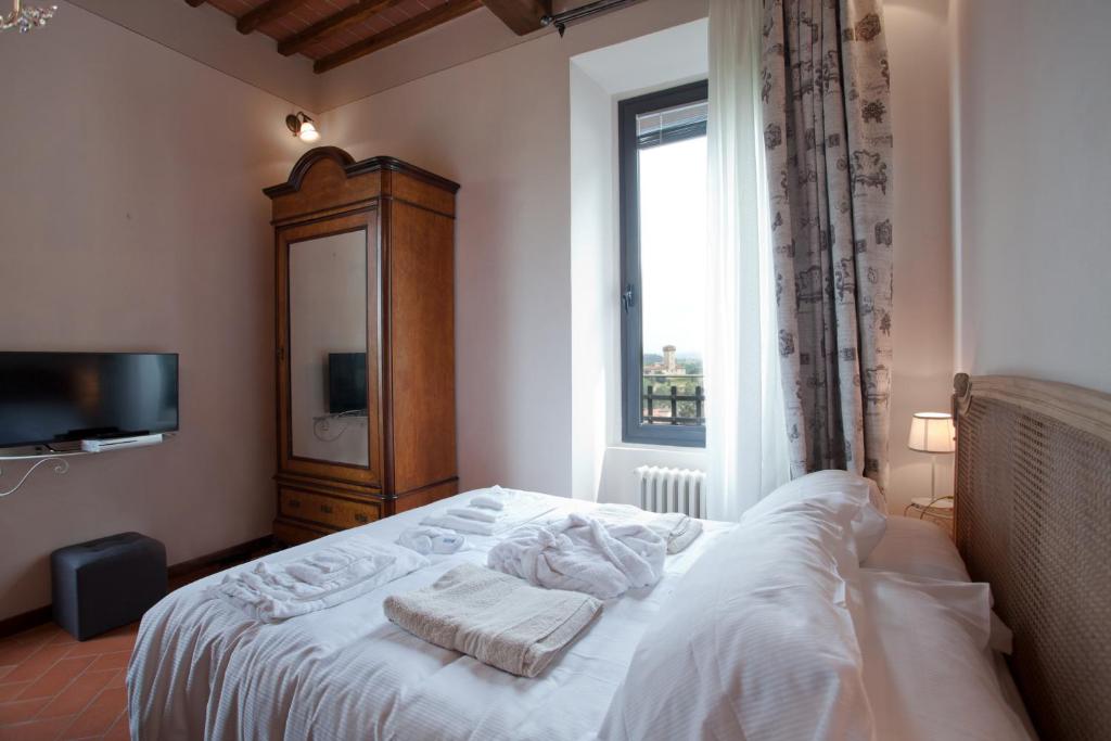 Posteľ alebo postele v izbe v ubytovaní Relais Villa Belvedere