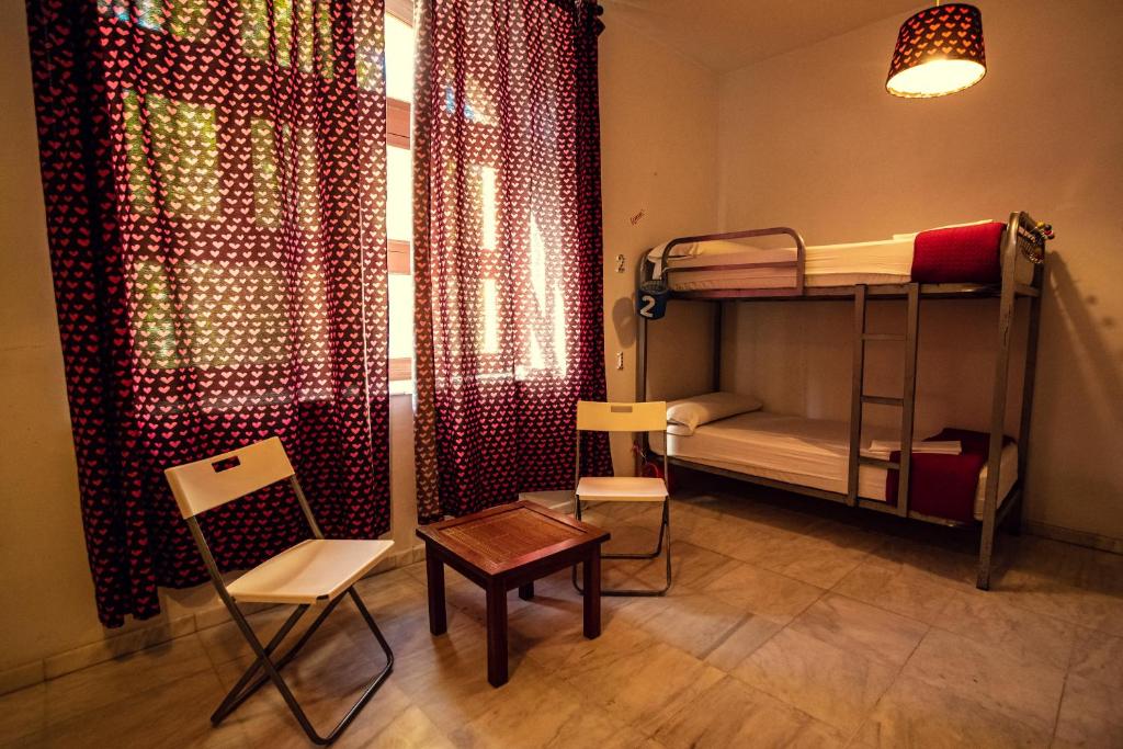 Postel nebo postele na pokoji v ubytování La Flamenka Hostel