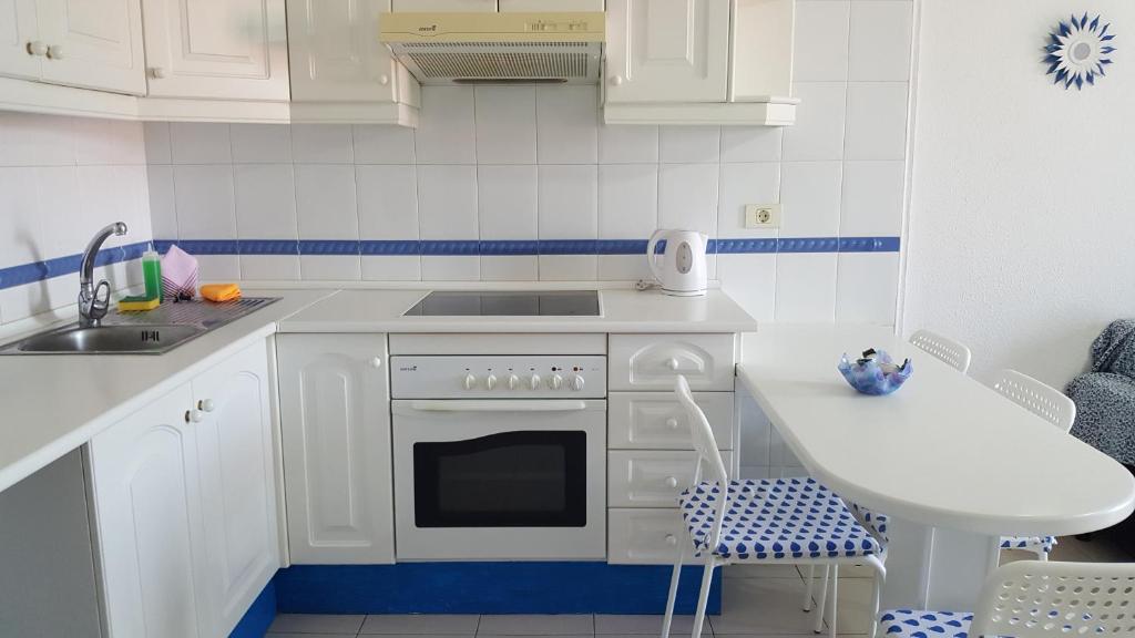 A kitchen or kitchenette at Las Galletas House