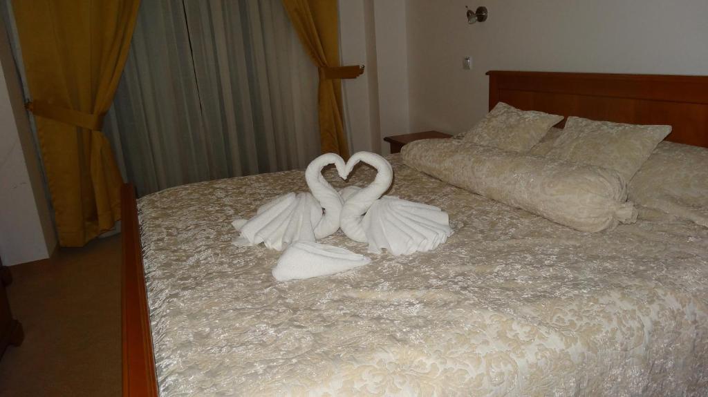 Postel nebo postele na pokoji v ubytování Hotel Garden