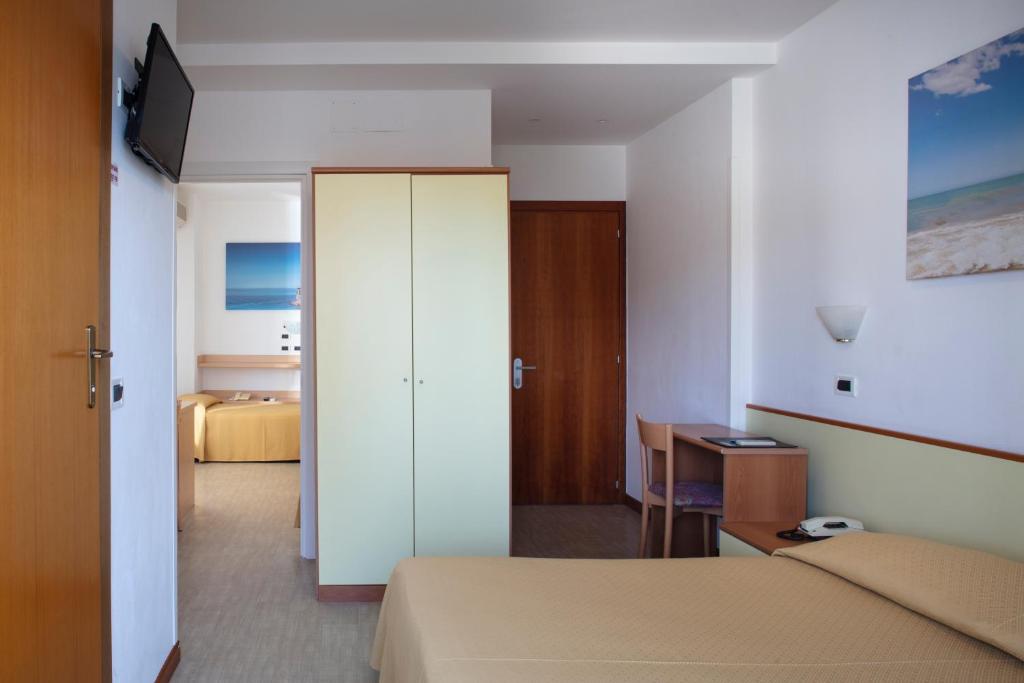 Postel nebo postele na pokoji v ubytování Hotel Pelikan