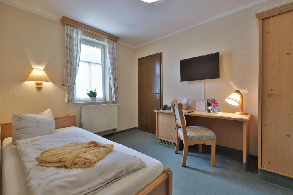 Rúm í herbergi á Hammermühle Hotel & Gesundheitsresort