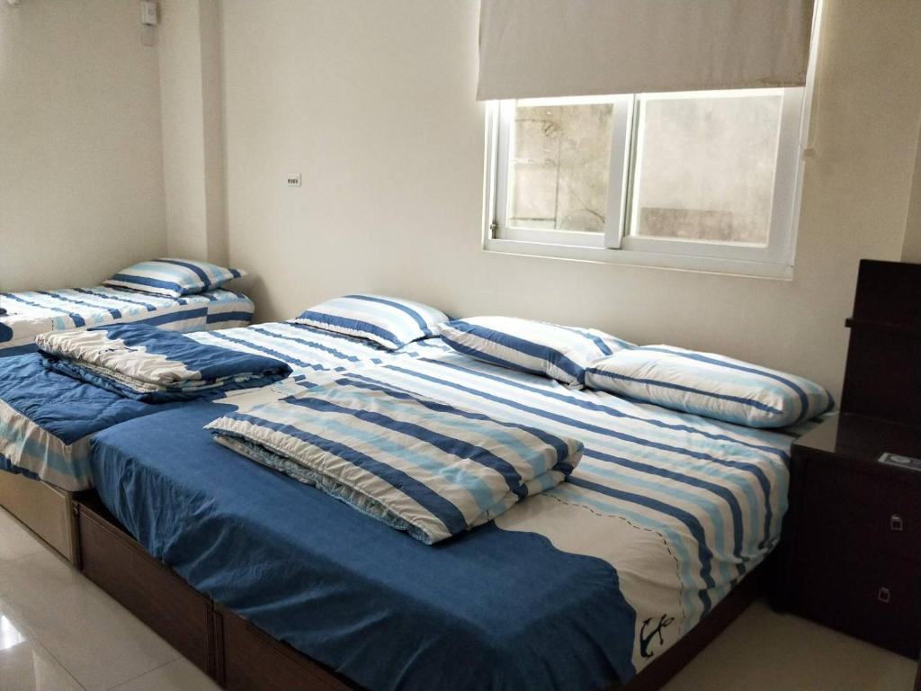 Postel nebo postele na pokoji v ubytování Wish enjoy happy Homestay