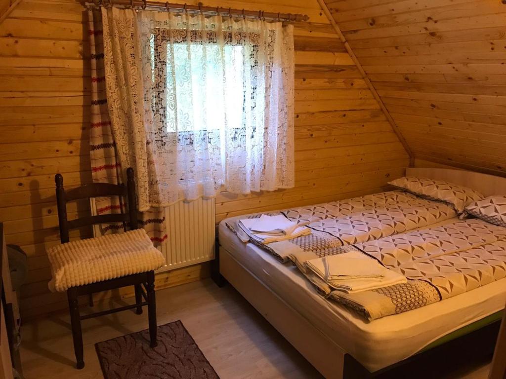 Säng eller sängar i ett rum på Casa de Vacanta Geoagiu de Sus