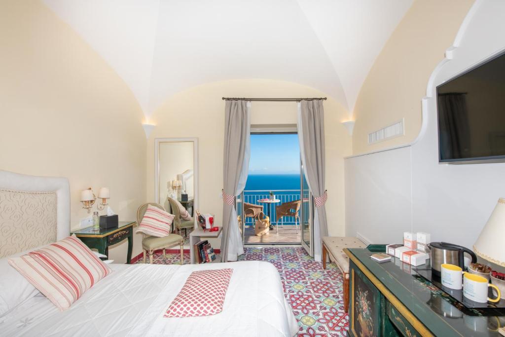 Postel nebo postele na pokoji v ubytování Hotel Margherita