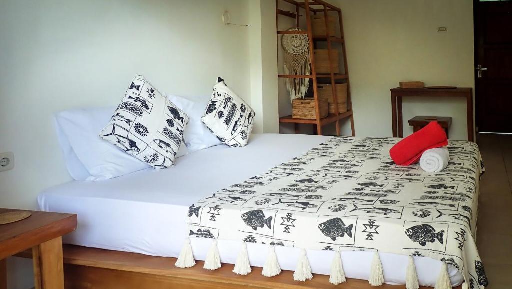 Postel nebo postele na pokoji v ubytování 3WILL Bunaken Dive Resort