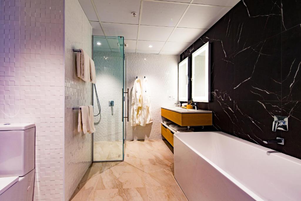 Koupelna v ubytování Novotel Tainui Hamilton