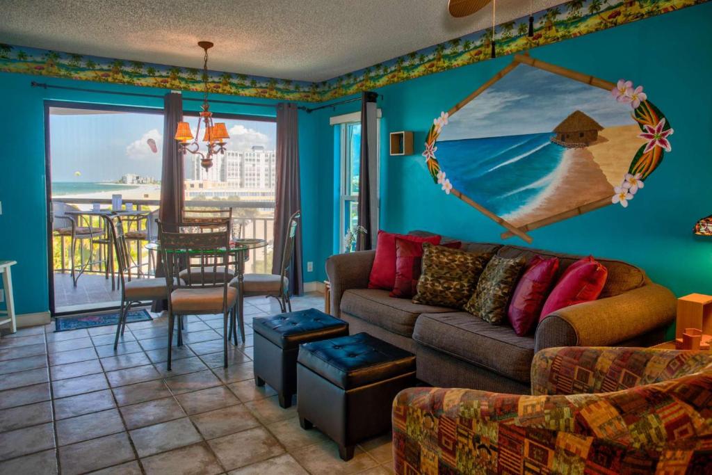 a living room with a couch and a view of the ocean at 505 - Gulf Strand in St Pete Beach