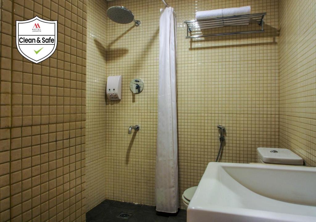 Koupelna v ubytování M Hotel