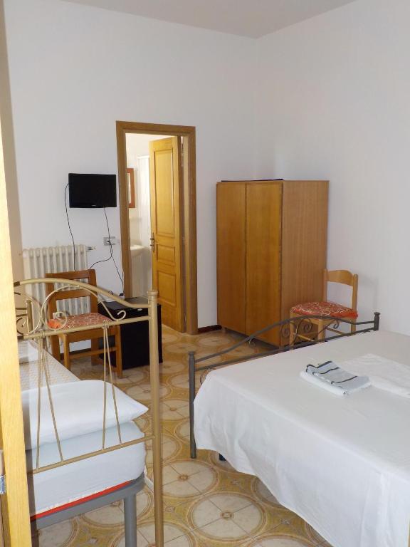 Postel nebo postele na pokoji v ubytování B&B Il Cedro
