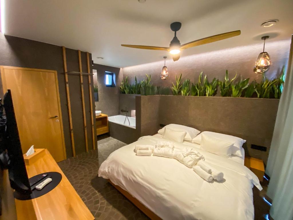 Posteľ alebo postele v izbe v ubytovaní Penzión & Wellness MERIDIANA Bojnice rezort