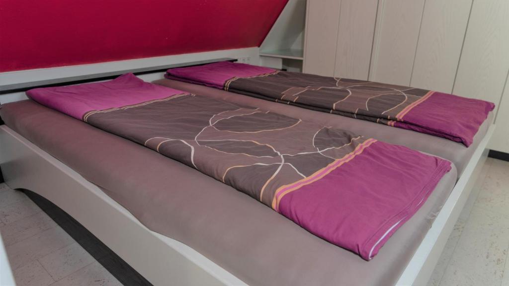 Postel nebo postele na pokoji v ubytování Ferienwohnung in der Mainleite für Vier