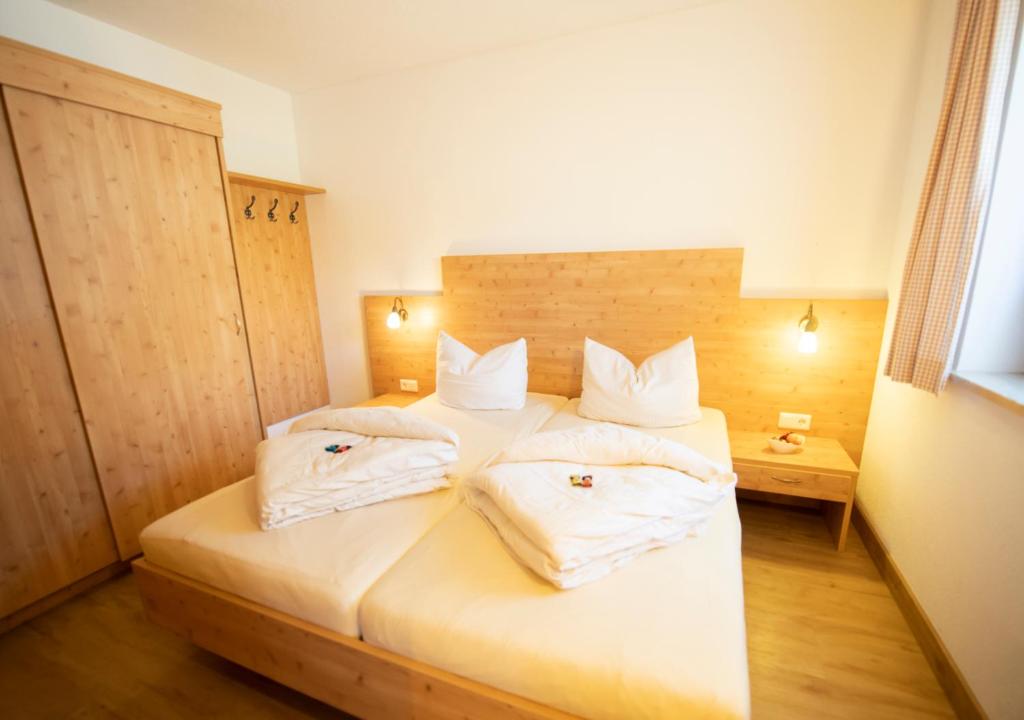 Posteľ alebo postele v izbe v ubytovaní Alpchalet Tirol