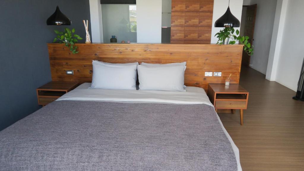 Rúm í herbergi á Kenting Cozy B&B