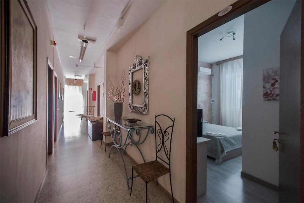 Postel nebo postele na pokoji v ubytování Hotel Sabatino