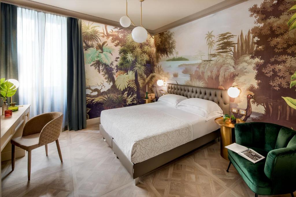 Łóżko lub łóżka w pokoju w obiekcie Hotel Savoia