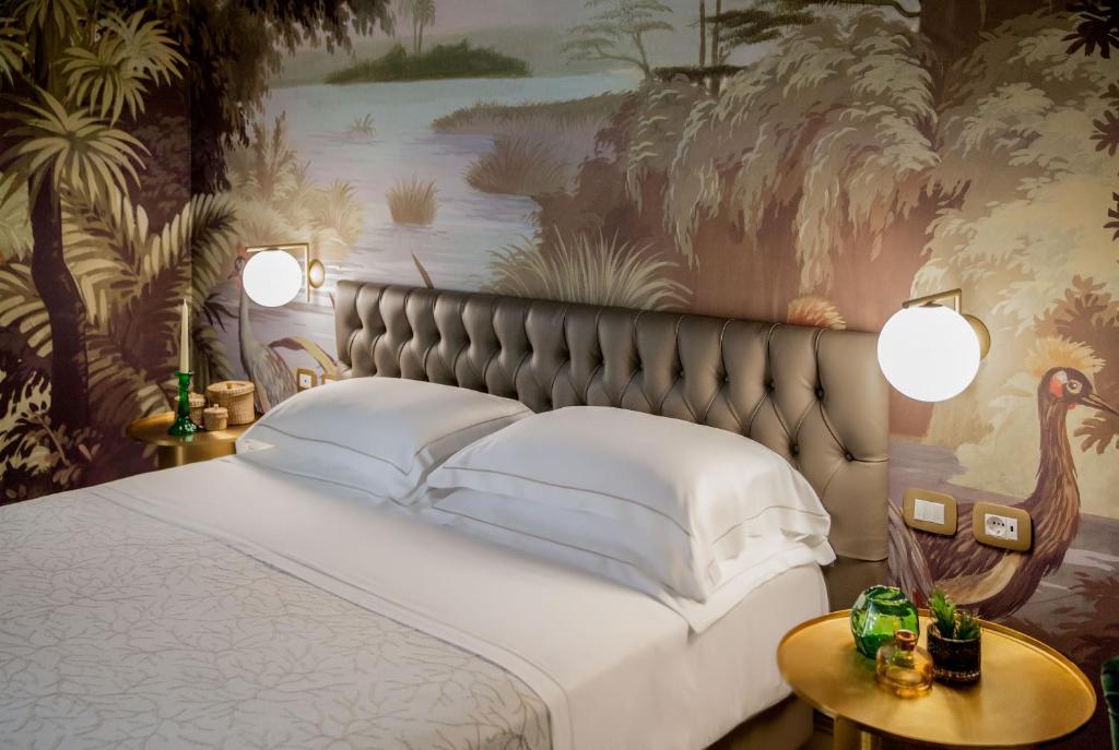 Łóżko lub łóżka w pokoju w obiekcie Hotel Savoia