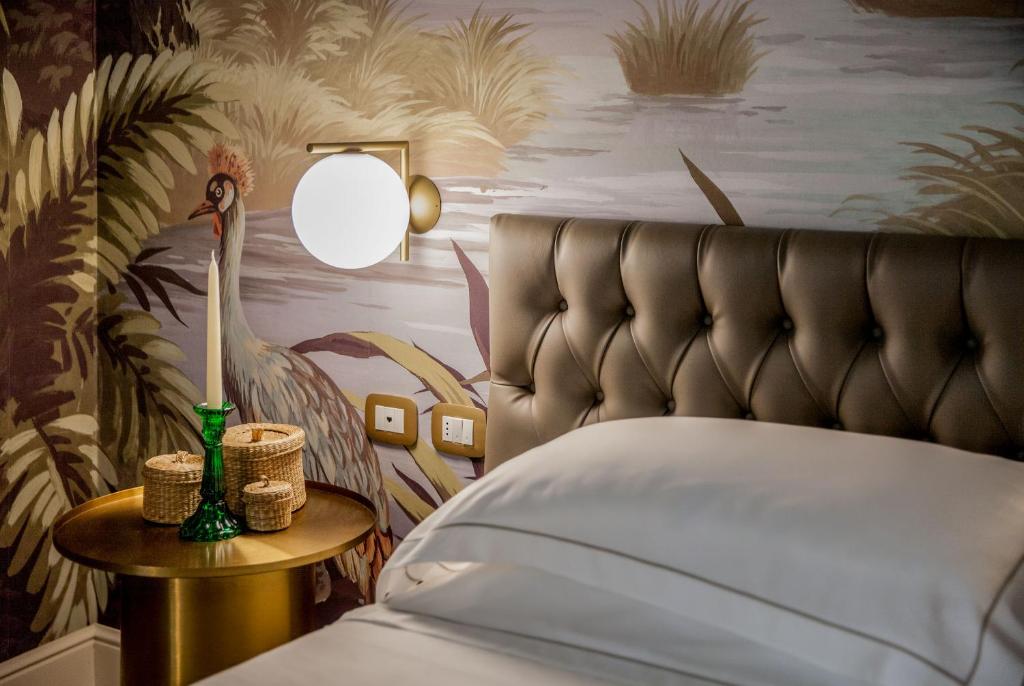 Łóżko lub łóżka w pokoju w obiekcie Hotel Savoia