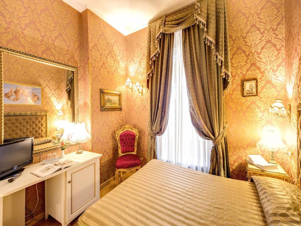 Postel nebo postele na pokoji v ubytování DCBoutiqueHotel