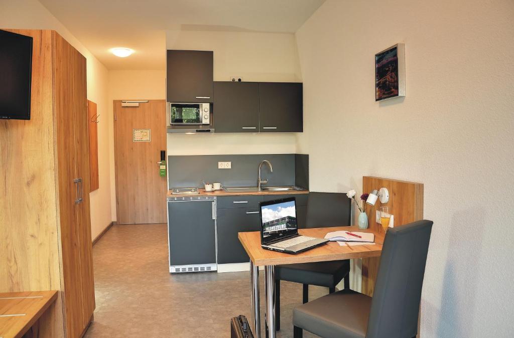 Kuchyň nebo kuchyňský kout v ubytování Motel am Fürfelder Schloss