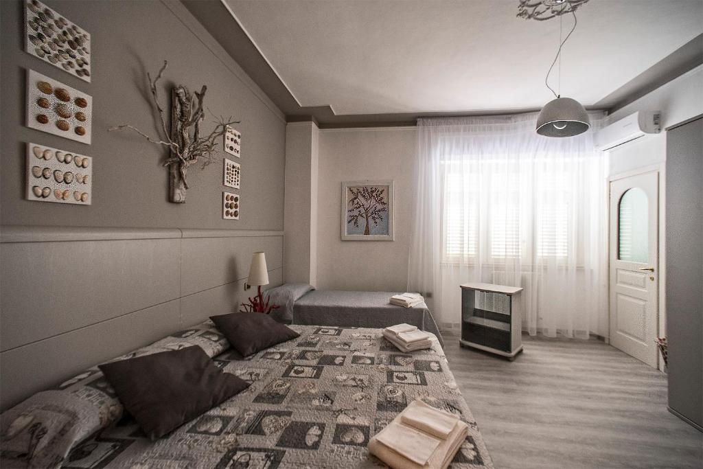 Postel nebo postele na pokoji v ubytování Hotel Sabatino