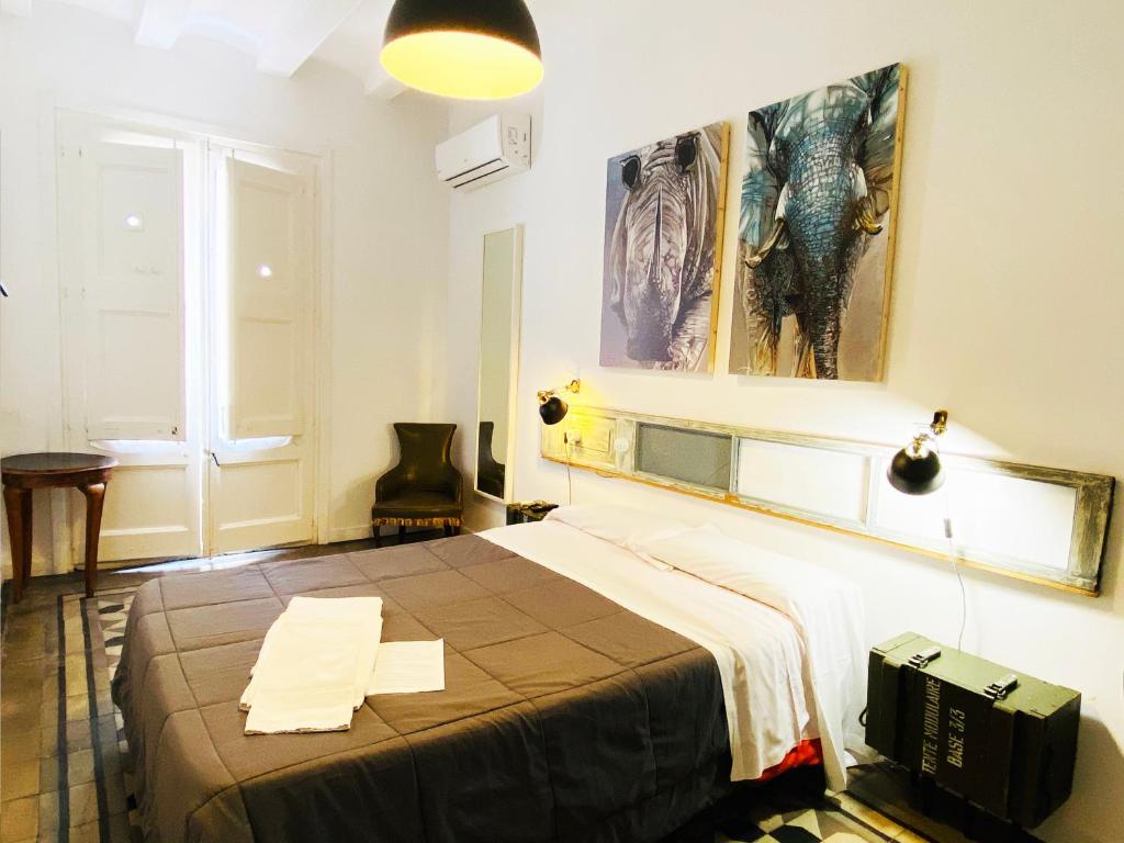 Posteľ alebo postele v izbe v ubytovaní Hostal Portugal