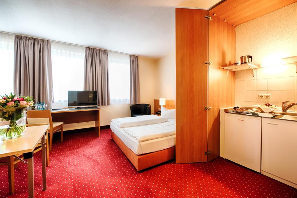 TV a/nebo společenská místnost v ubytování ACHAT Hotel Chemnitz