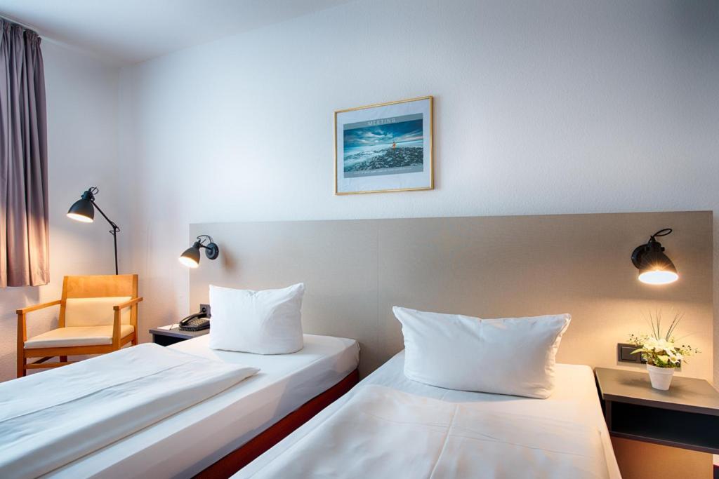 Postel nebo postele na pokoji v ubytování ACHAT Hotel Chemnitz