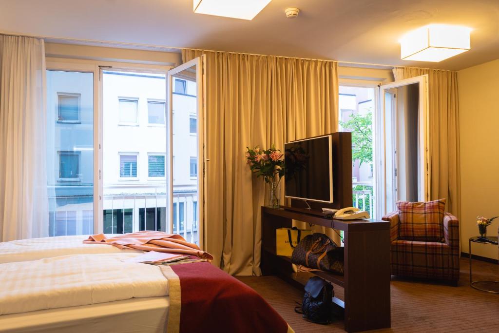 Postel nebo postele na pokoji v ubytování Hotel Stadt Kufstein