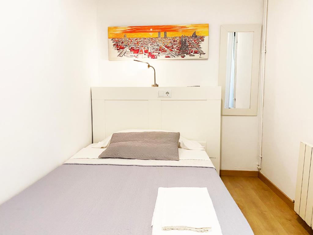 Posteľ alebo postele v izbe v ubytovaní Hostal Portugal