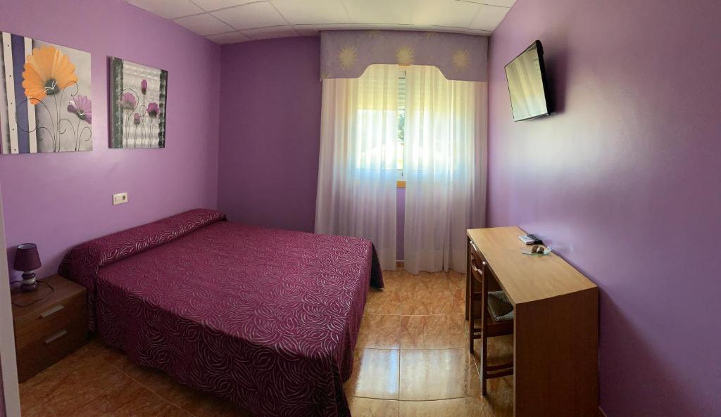 Postel nebo postele na pokoji v ubytování Hostal Expo