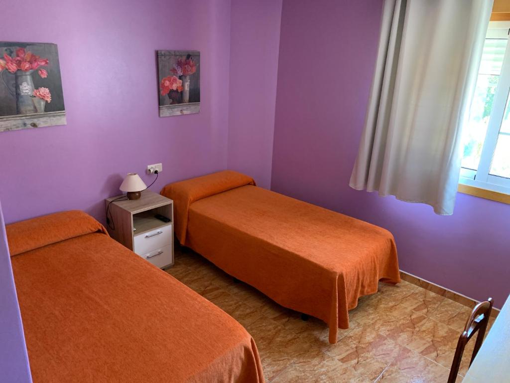 Postel nebo postele na pokoji v ubytování Hostal Expo