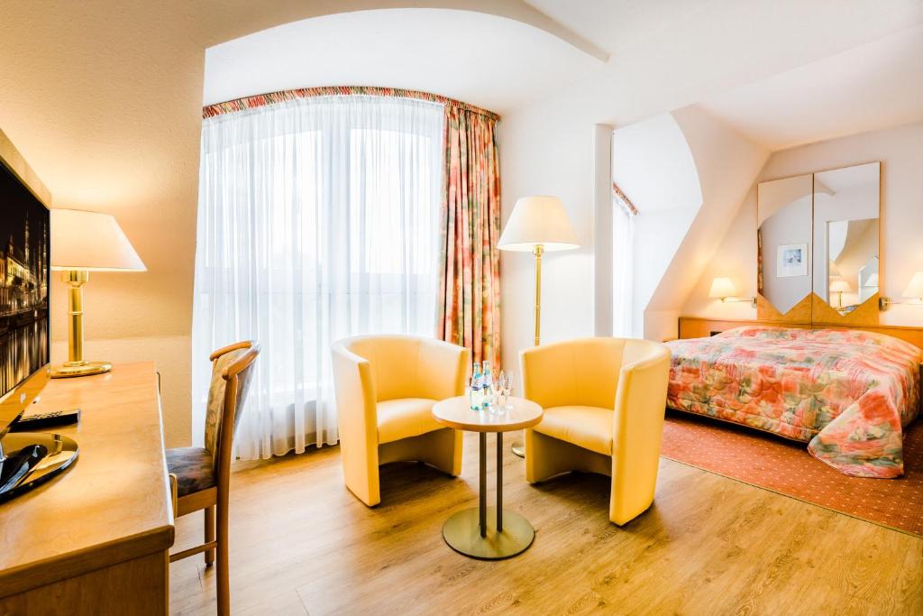 Postel nebo postele na pokoji v ubytování Taste Hotel Dresden-ehemals Residenz Alt Dresden