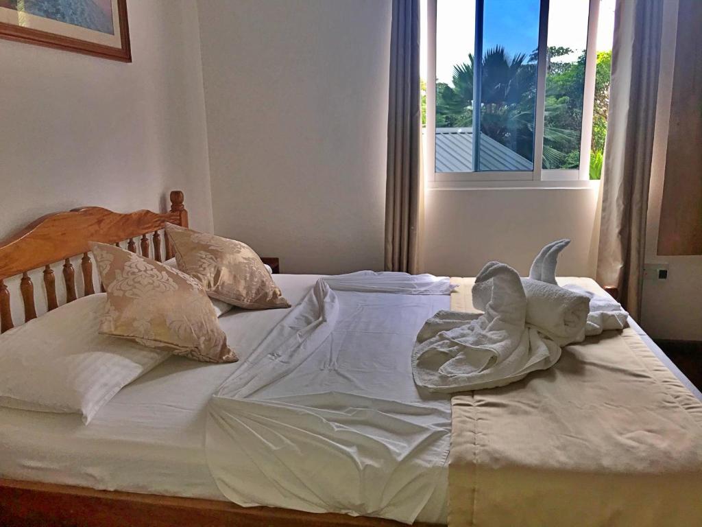 Postel nebo postele na pokoji v ubytování Acquario Guesthouse