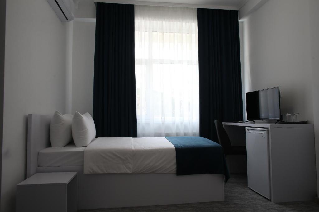 Postel nebo postele na pokoji v ubytování Glass Cube Hotel