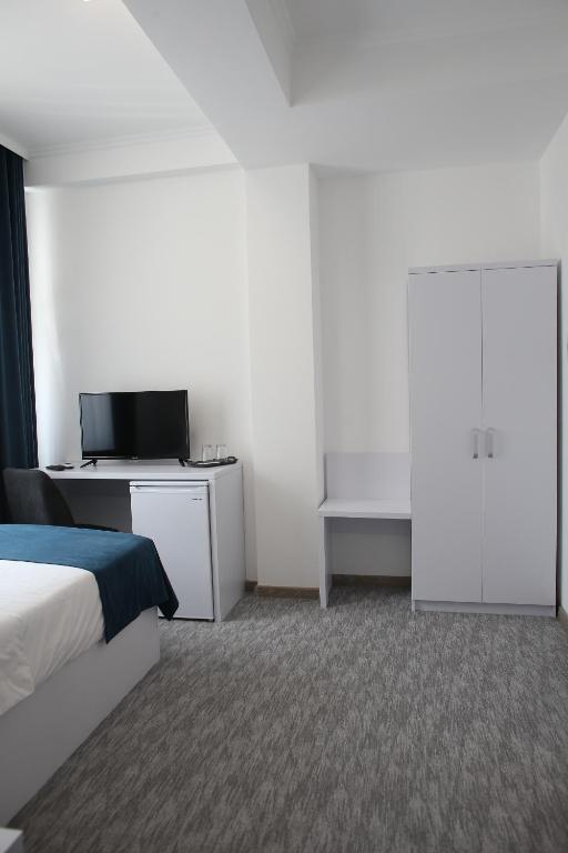 Postel nebo postele na pokoji v ubytování Glass Cube Hotel