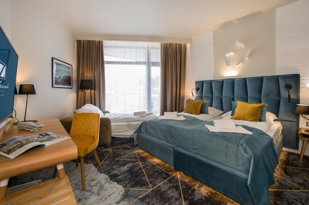 Postel nebo postele na pokoji v ubytování Hotel Zalewski