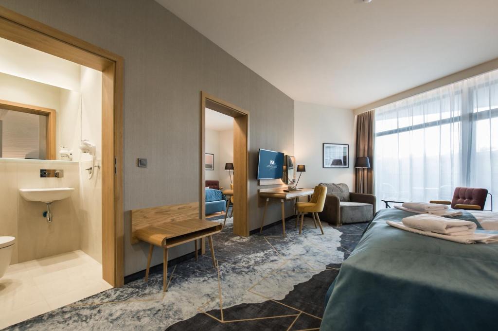 Postel nebo postele na pokoji v ubytování Hotel Zalewski