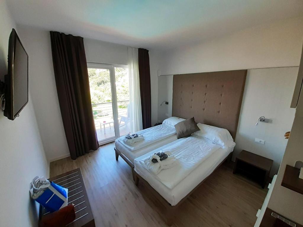 Postel nebo postele na pokoji v ubytování Park Hotel Val Di Monte ***S