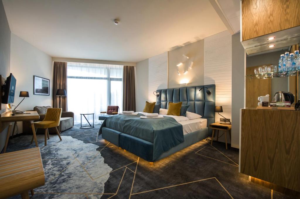 Postel nebo postele na pokoji v ubytování Hotel Zalewski
