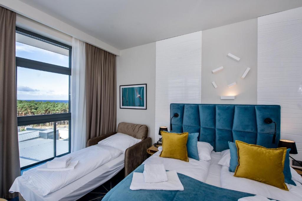 Postel nebo postele na pokoji v ubytování Hotel Zalewski