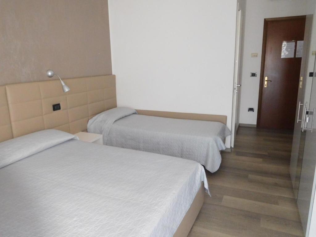 Postel nebo postele na pokoji v ubytování Hotel Emperador