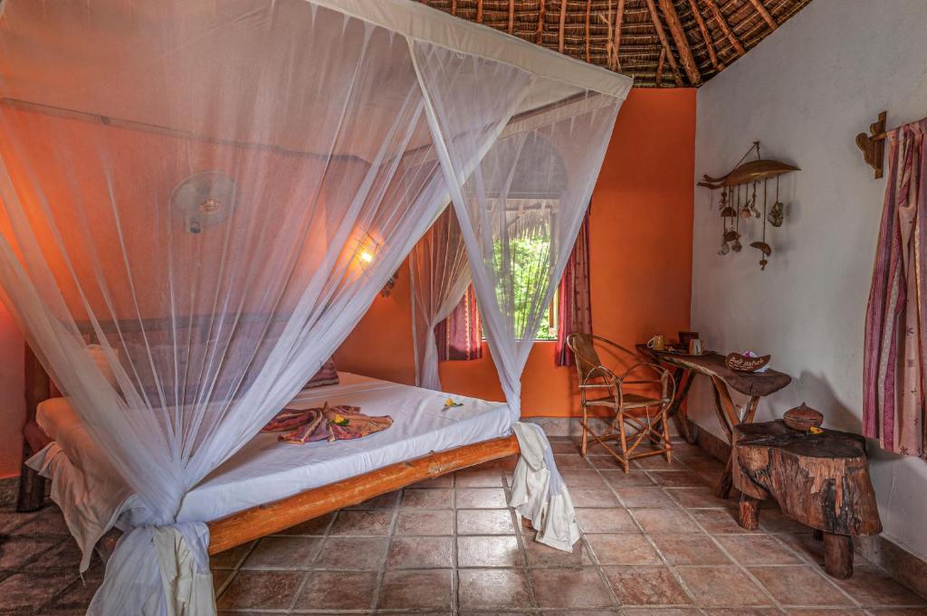 Postel nebo postele na pokoji v ubytování Karamba Eco Boutique Hotel