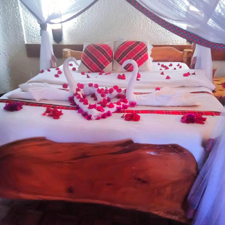 Llit o llits en una habitació de Masai Lodge