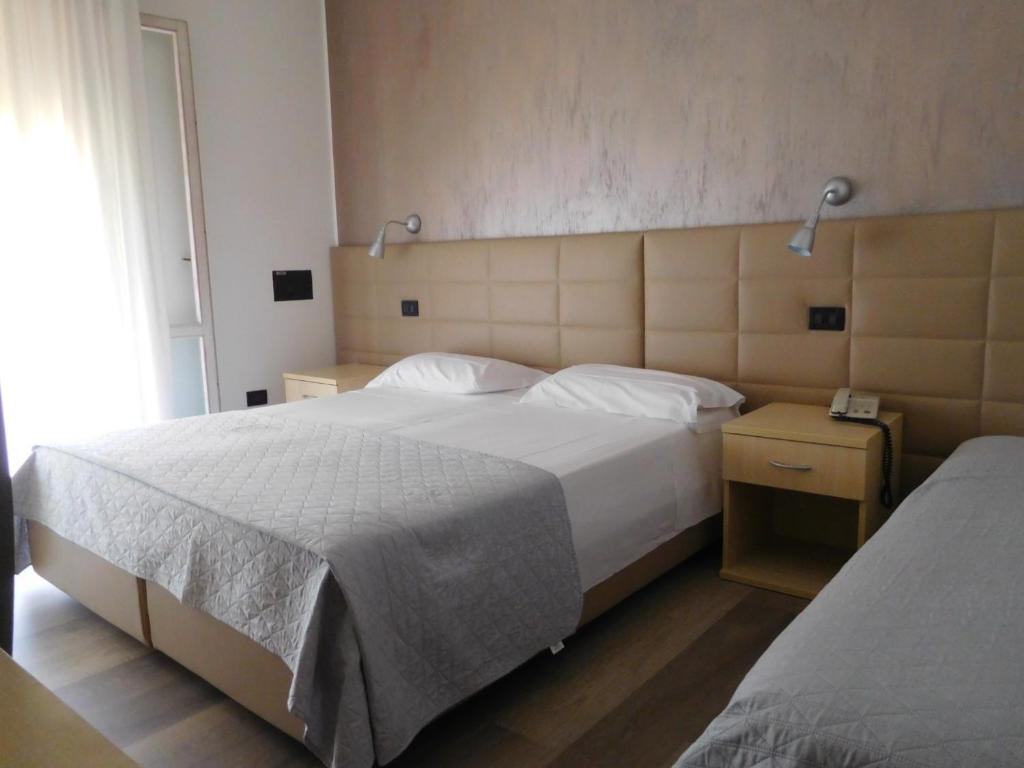 Postel nebo postele na pokoji v ubytování Hotel Emperador
