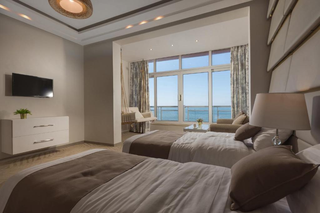Postel nebo postele na pokoji v ubytování Miramar Boutique Hotel