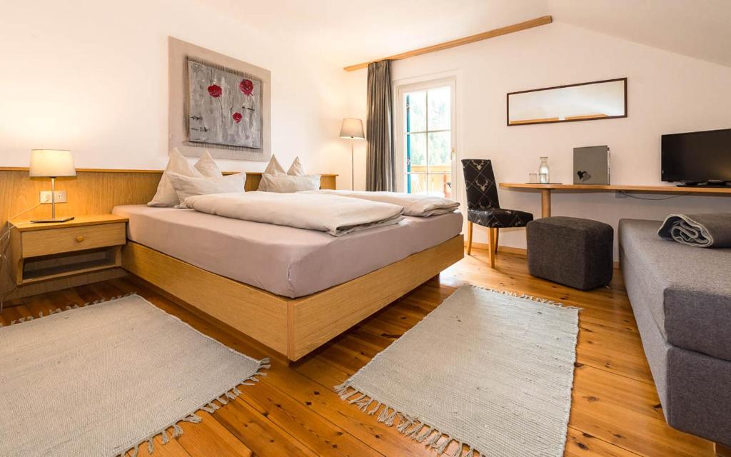 Postel nebo postele na pokoji v ubytování Haus Claudia B&B