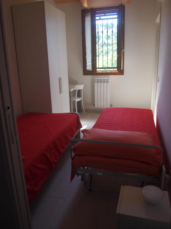 Postel nebo postele na pokoji v ubytování Agriturismo Ardizio 43