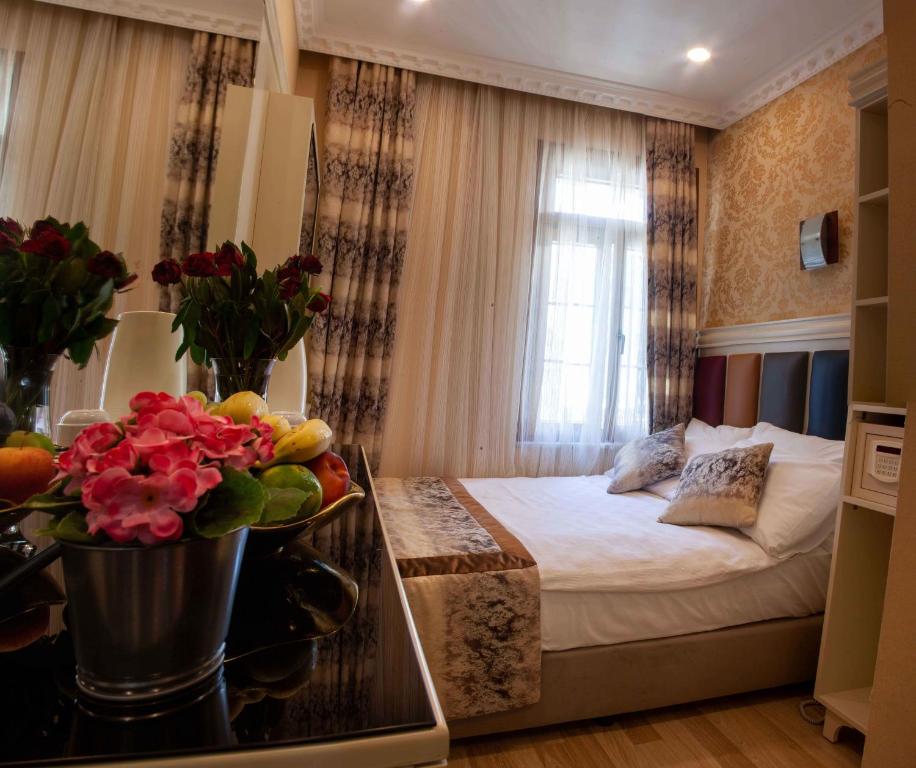 Postel nebo postele na pokoji v ubytování Best Nobel Hotel