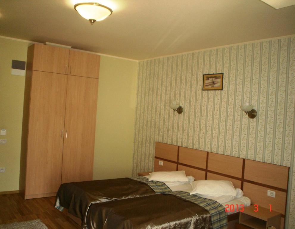 Postel nebo postele na pokoji v ubytování Hotel Stogu